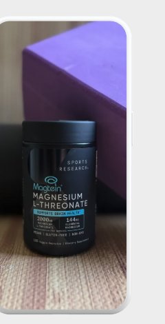 Magnesium L-Threonate supplement bottle on a wood floor beside a yoga block.